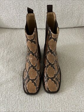 Sam Edelman Snake-Print Chelsea Ankle Boots in Tan and Black.